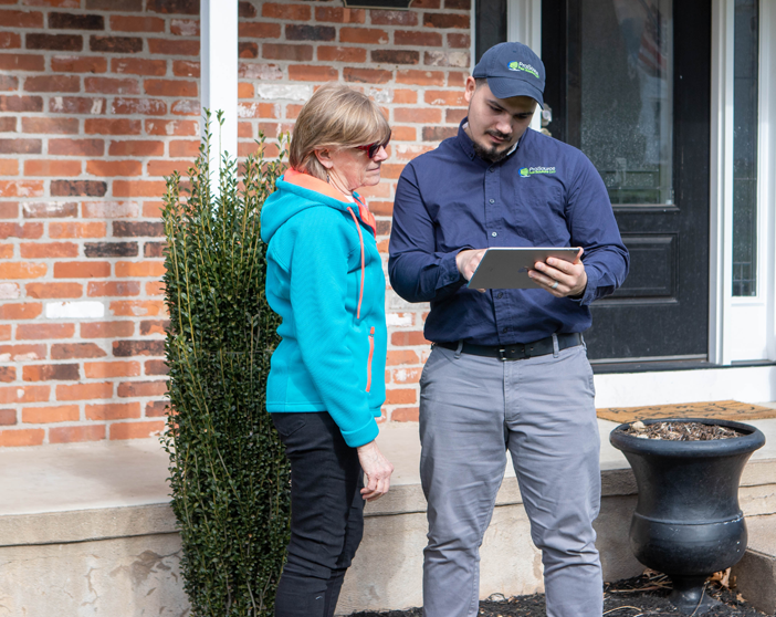 A ProSource Pest tech working with a client at her home in Southington, CT.
